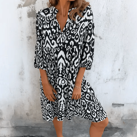 Linda™ | Dröm dig bort i boho-chic charm med denna luftiga midiklänning